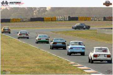 The long queue of Historic Handicap cars catching up in the closing stages of the race